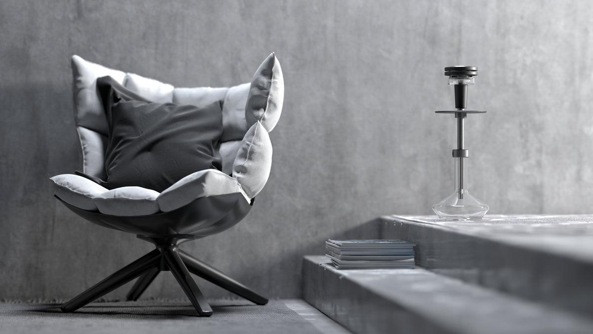 Quasar Raas 2 in a minimalistic setting, next to a stylish chair, showcasing its integration into home decor
, image 17 of 17