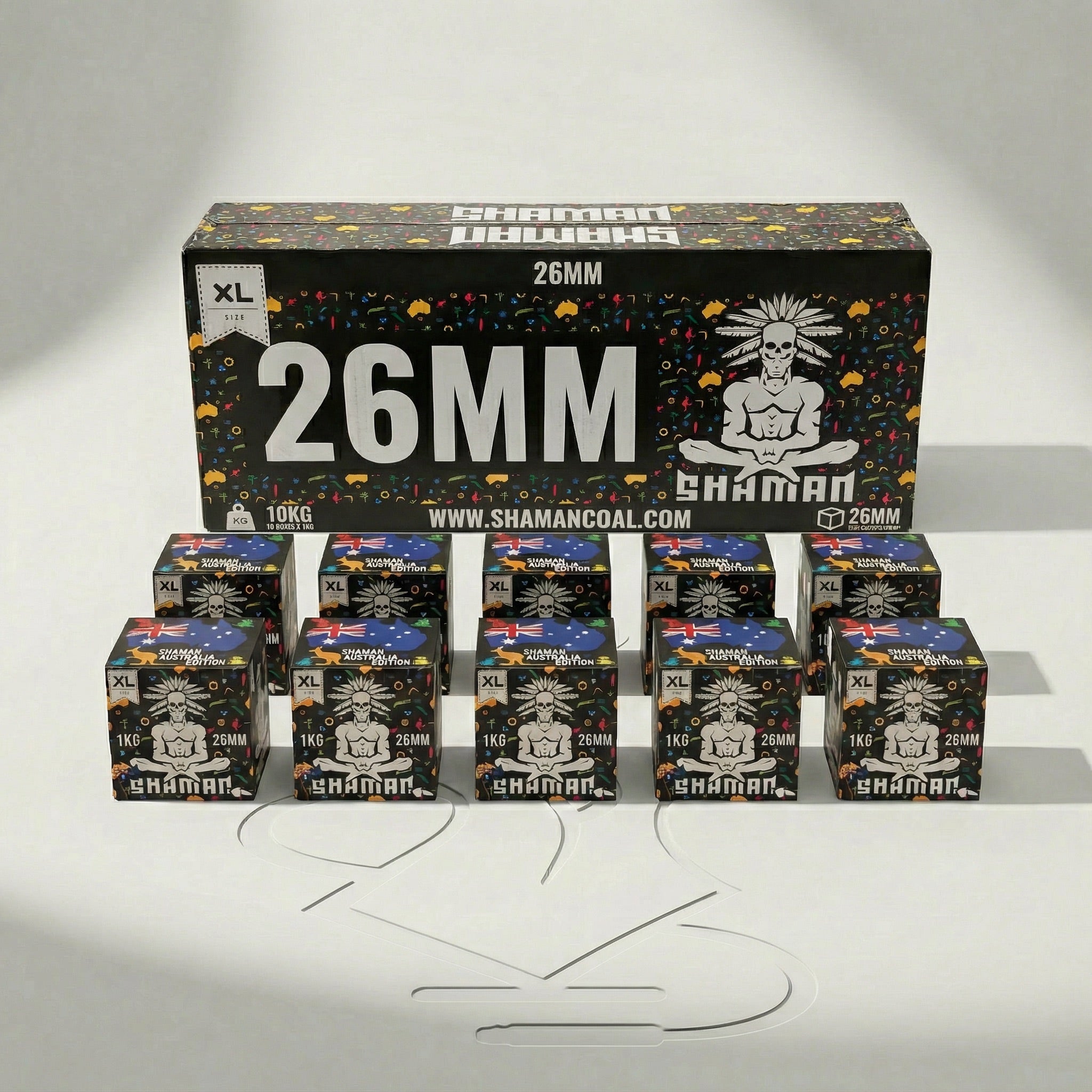 Shaman 26mm coconut charcoal 10kg master box at a three-quarter angle showing the front face and Australia Edition side panel in a professional studio setting.