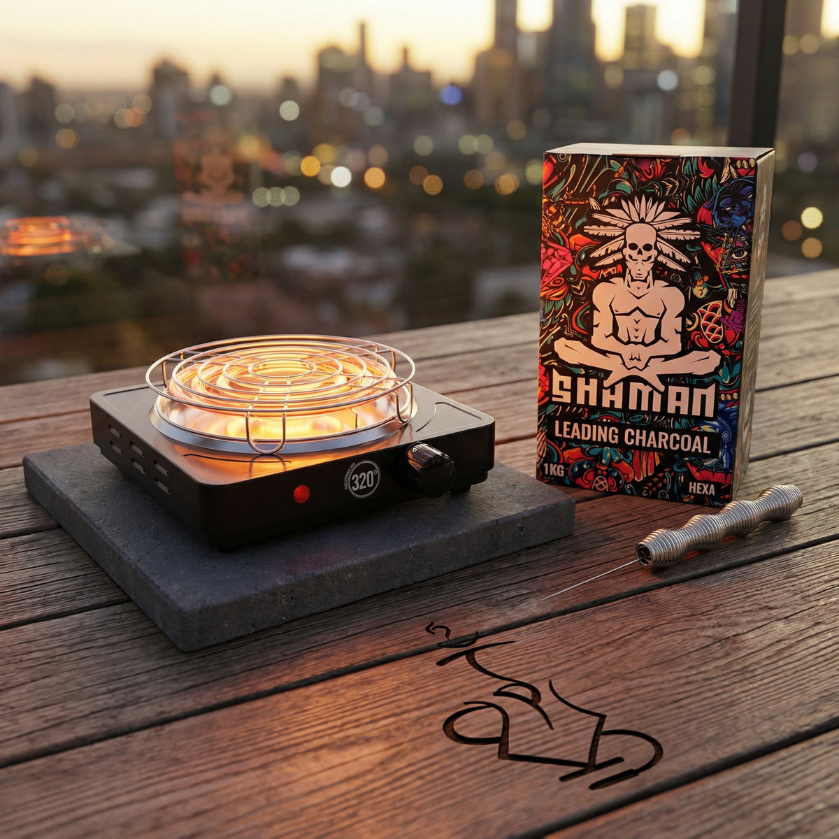 The 320 electric charcoal burner glowing on a dark concrete paver beside a Shaman Hexa coconut charcoal box and Smoothpoke poker on a Melbourne balcony at golden hour, from The Premium Way., image 7 of 12