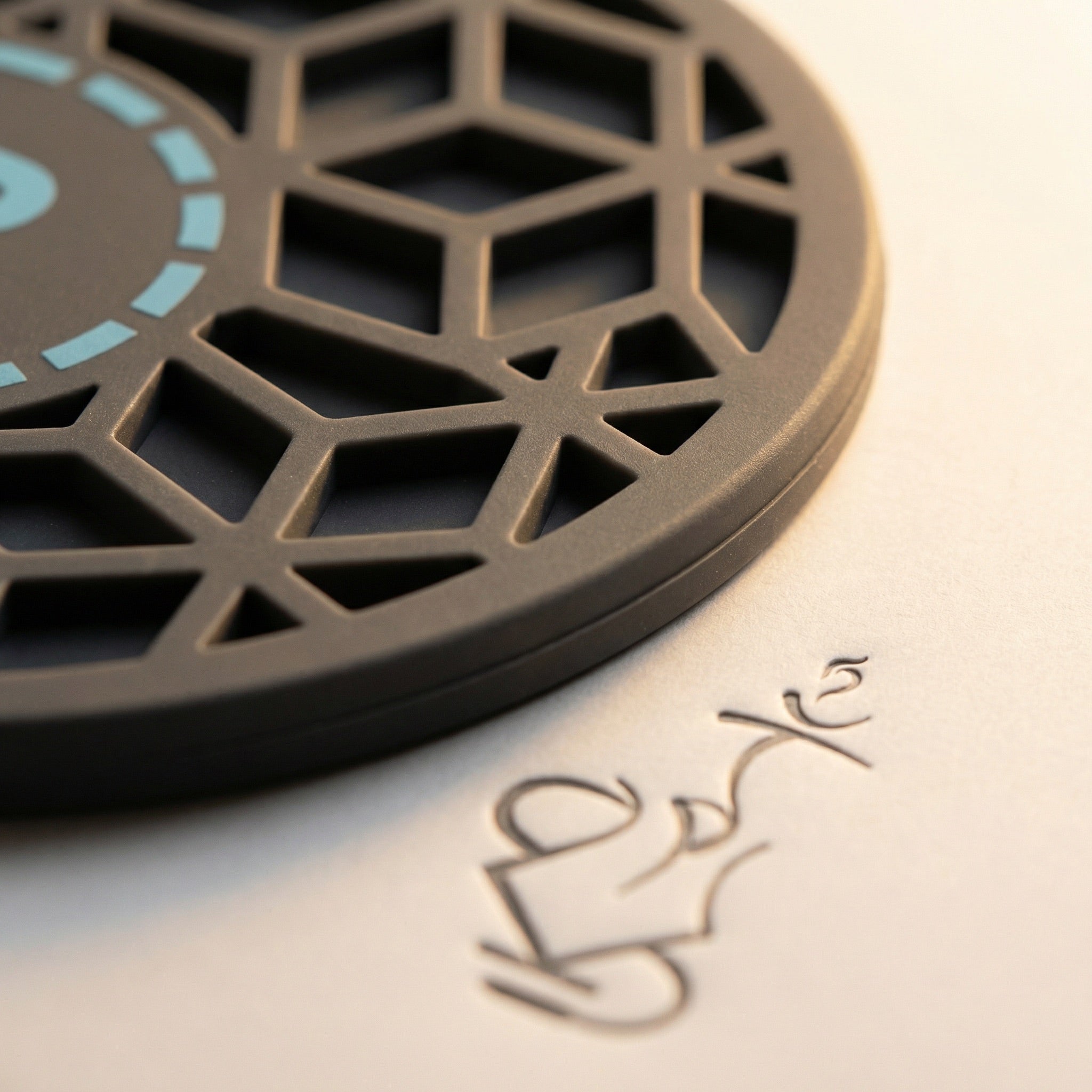 Close-up macro of the 320° Hookah Base Mat's bespoke cube-pattern top face, showing the three-dimensional recessed silicone lattice and soft matte finish.