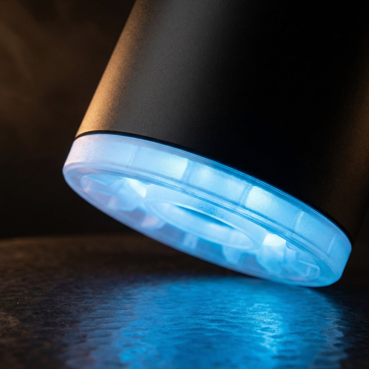 Macro close-up of the 320° LED shisha starter pump's translucent LED ring glowing cool blue, showing the ring's internal diffuser detail in action., image 6 of 12