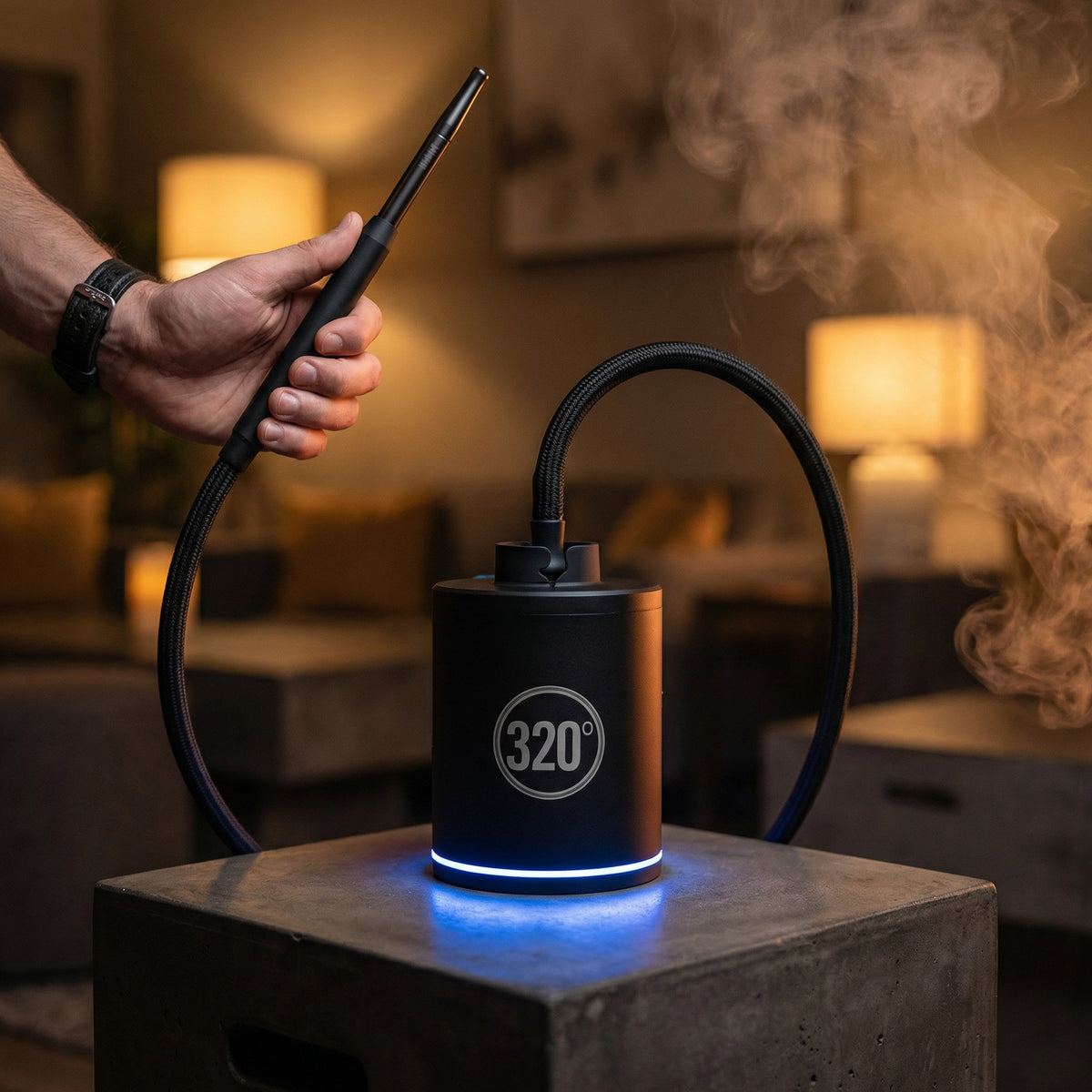 320° LED electric coal starter pump in use during a hookah session with the LED ring glowing cool blue and a braided hose connected to the top cradle — the automatic draw pump that starts your hookah for you., image 3 of 12