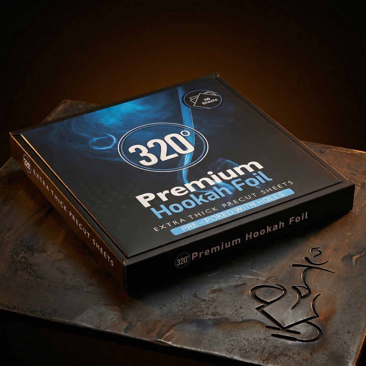 320° Premium Hookah Foil box lit dramatically on a dark forged steel surface, showing the extra thick precut pre-poked shisha foil sheets packaging in warm editorial light., image 2 of 16