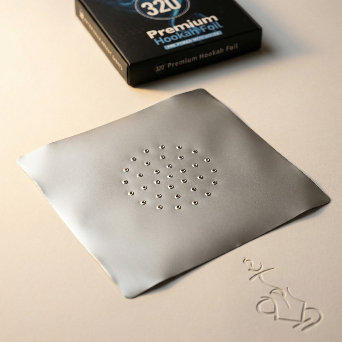 Close-up detail of the 320° Premium Hookah Foil packaging showing the circular logo mark and the blue "Pre-Poked With Holes" ribbon against the blue smoke artwork., image 6 of 16