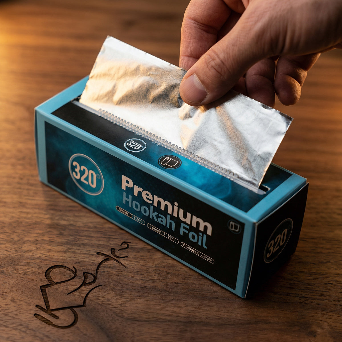 320° Shisha Foil dispenser box mid-dispense, showing the integrated slide cutter and foil being pulled cleanly from the box for premium hookah session prep., image 5 of 13