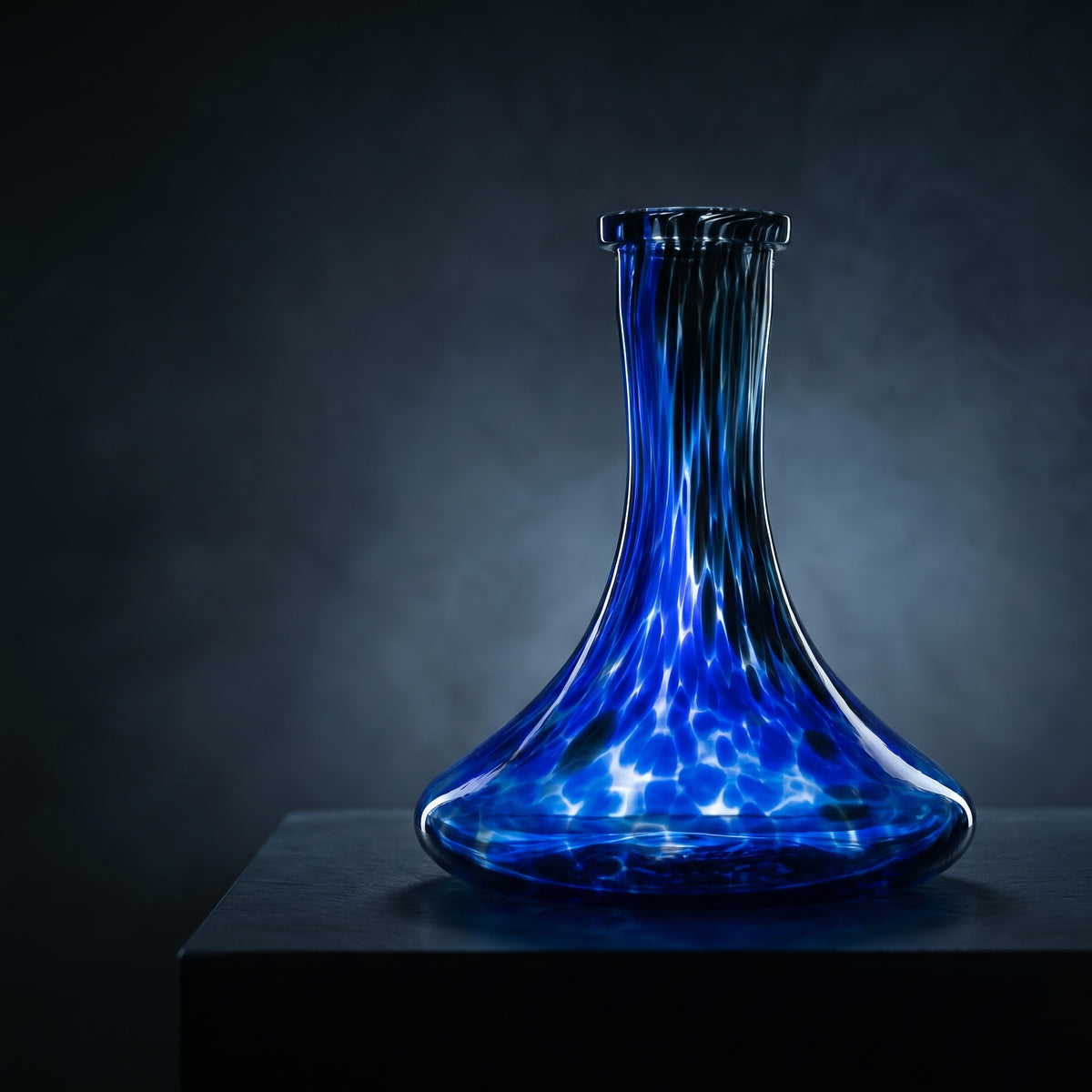 Cobalt Galaxy hand-blown shisha vase glowing on a dark slate plinth in a cool gallery interior, image 2 of 5