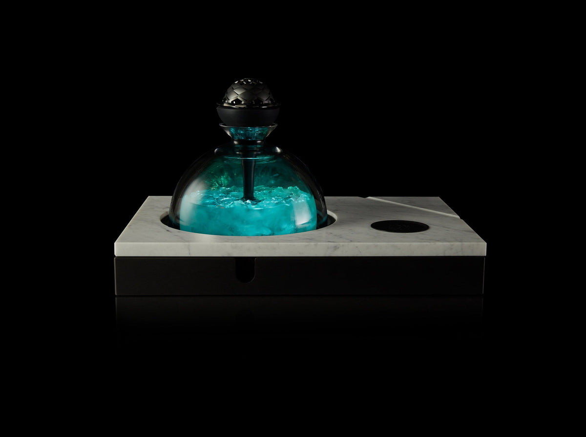 Kaloud Selestia LED light fitted under a Kaloud Krysalis, glowing teal, image 3 of 8