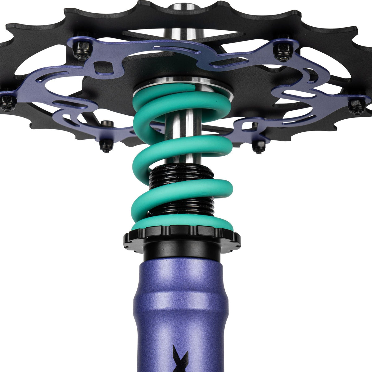 Amotion Pedal RX Grape chainring underside close-up — purple bike-style cog over the teal coil spring and stem, image 6 of 7