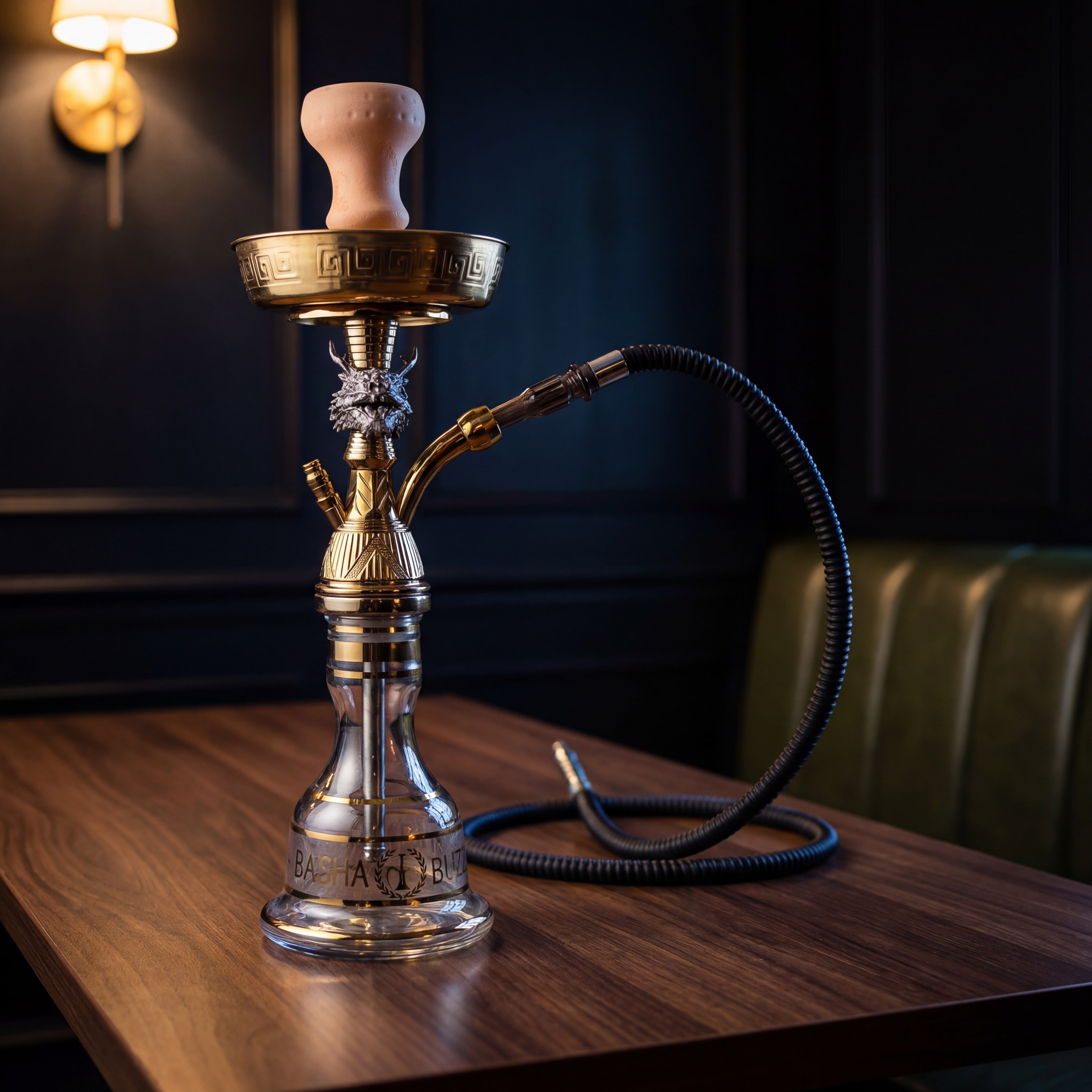 Basha Buzz Draco 44cm shisha pipe on dark walnut table in speakeasy booth, silver dragon and gold stem detail