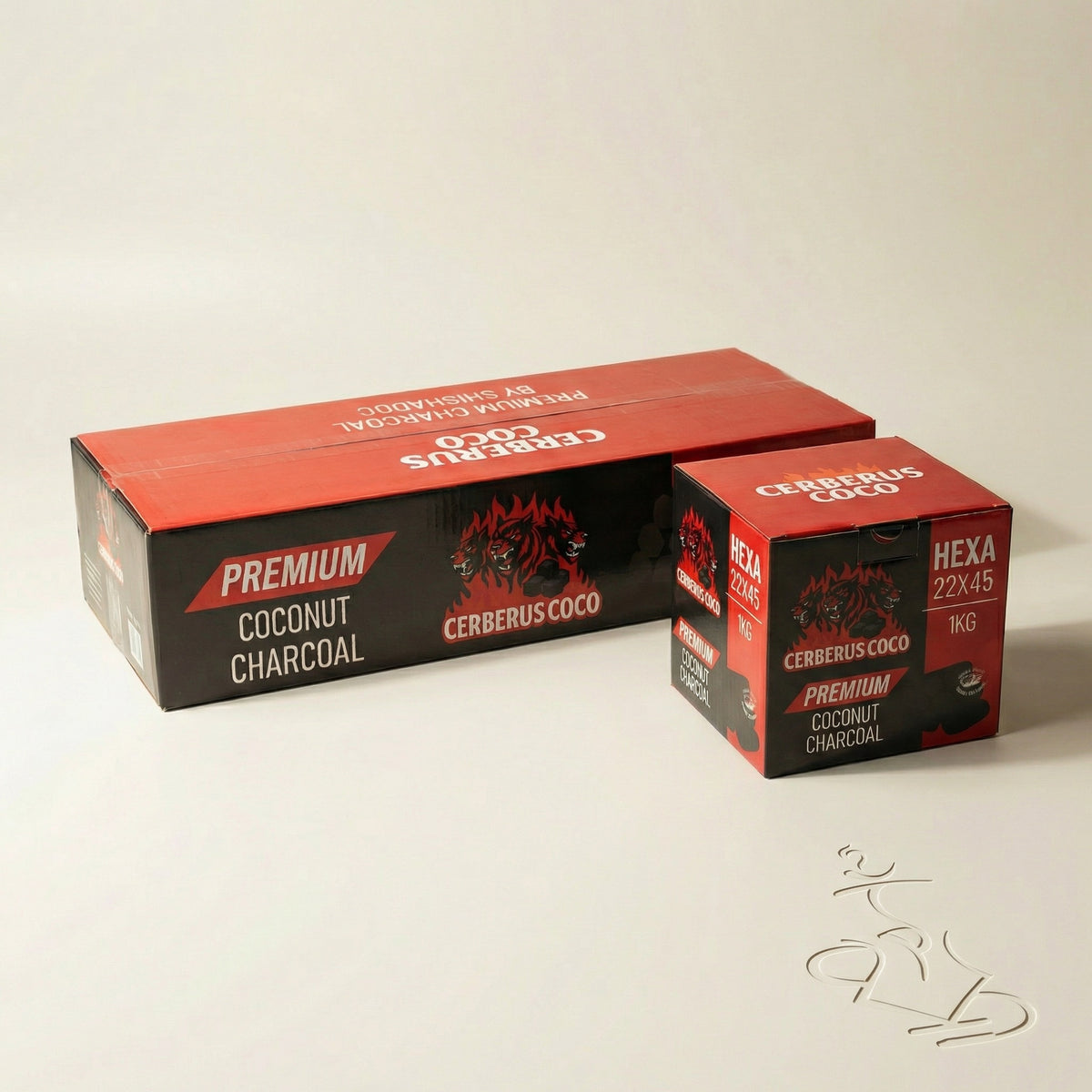 Cerberus Coco Hexa 22×45mm coconut charcoal 1kg retail box beside the 10kg landscape carton showing size comparison on a warm white studio background, image 6 of 6