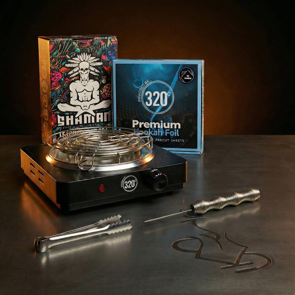 The Premium Way complete shisha prep kit bundle lit dramatically against a warm dark editorial backdrop, showing the 320 electric burner, Shaman Hexa charcoal, premium foil, Smoothpoke poker and tongs., image 3 of 12
