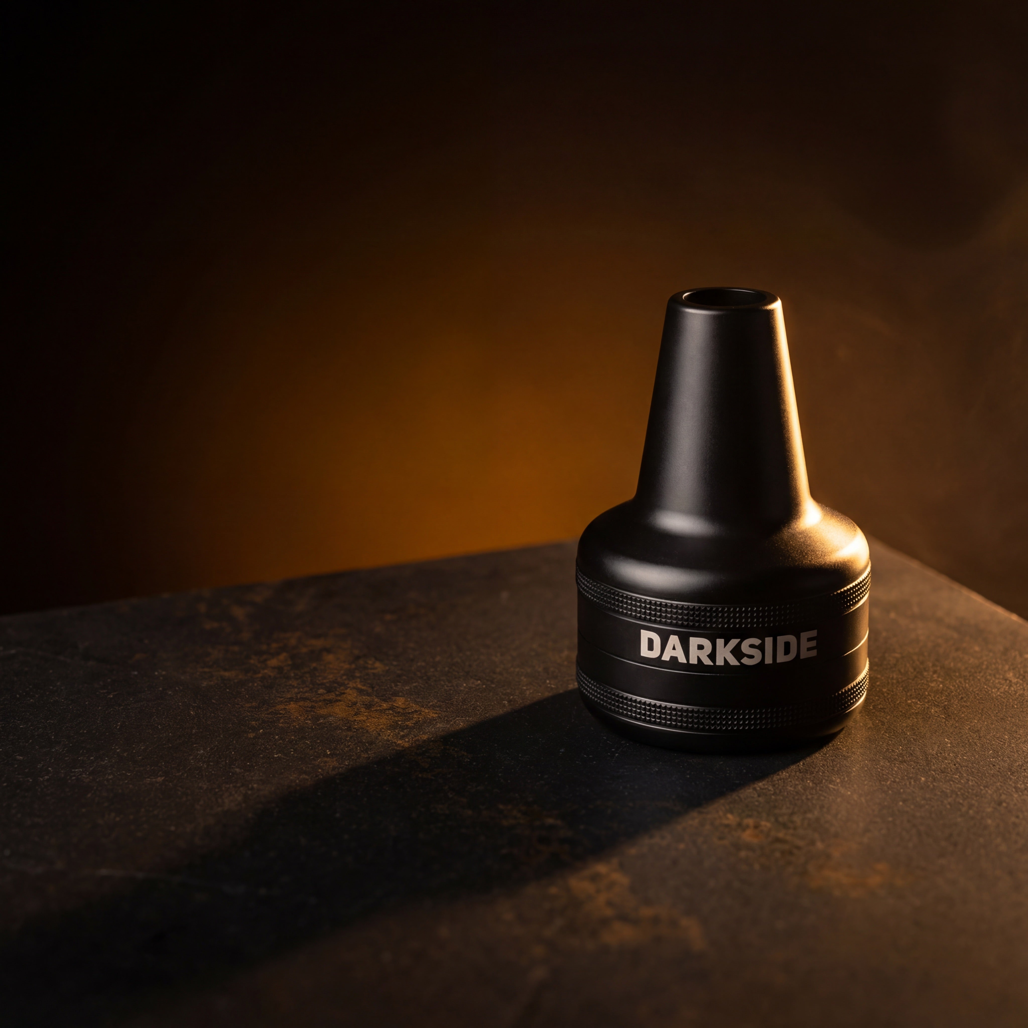 Darkside D-Catcher matte black aluminium molasses catcher on dark basalt, warm amber lighting, The Premium Way
