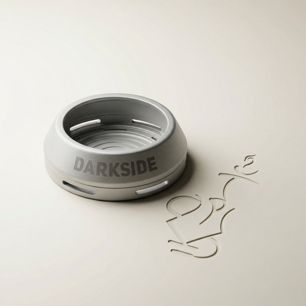 Darkside D-Heater Silver lidless anodised aluminium HMD photographed on a warm white studio sweep, showing the tapered outer profile and debossed DARKSIDE wordmark., image 14 of 21