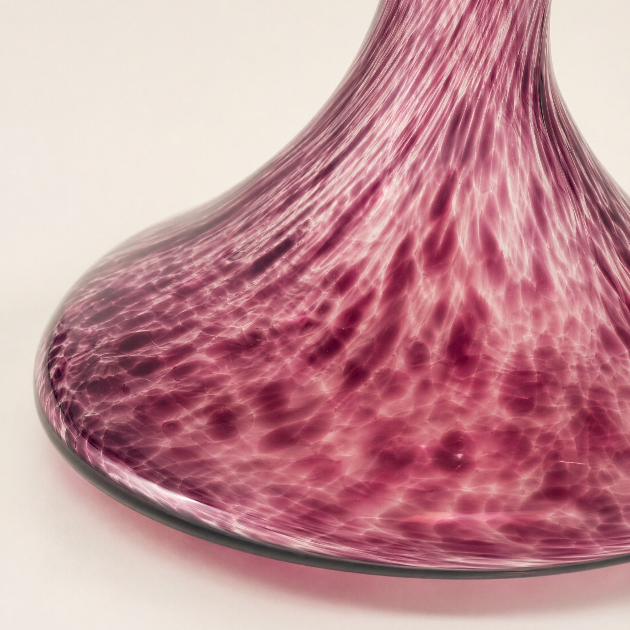 Close-up of the Amethyst Marble vase belly showing internal white marble streaks fused through saturated purple glass