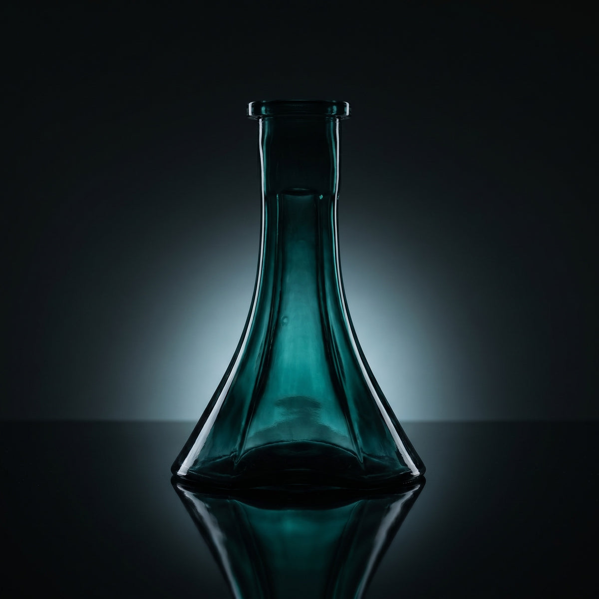 Forest Trefoil shisha vase silhouetted on dark mirror, deep green glass glowing from within, sculptural three-lobe form, image 2 of 3