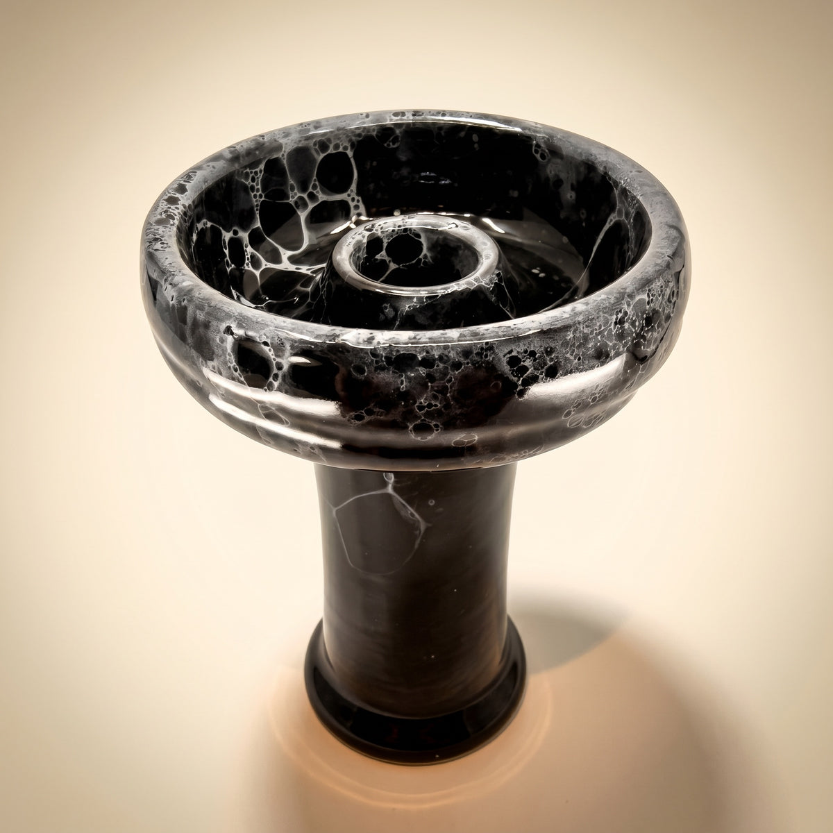 Essentials Joker Phunnel variant thumbnail — Noir glossy black with silver-grey bubble-marble glaze, cream studio backdrop., image 4 of 5