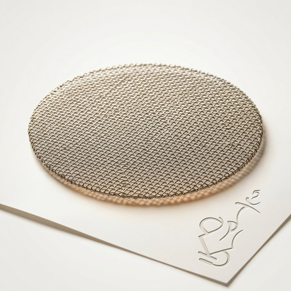 Essentials stainless steel mesh screen bowl insert, a food-grade woven disc that sits inside traditional Egyptian clay shisha bowls to block leaf debris from falling into the base., image 3 of 6
