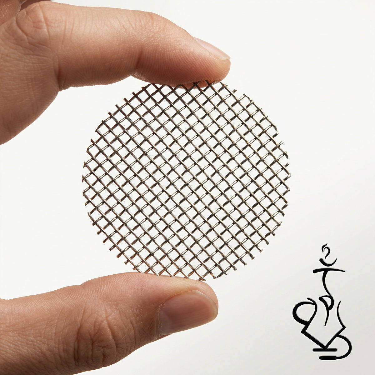A hand holding the Essentials stainless steel mesh bowl insert between thumb and forefinger, showing the approximate 7 cm diameter and fine food-grade woven stainless wire weave., image 2 of 6