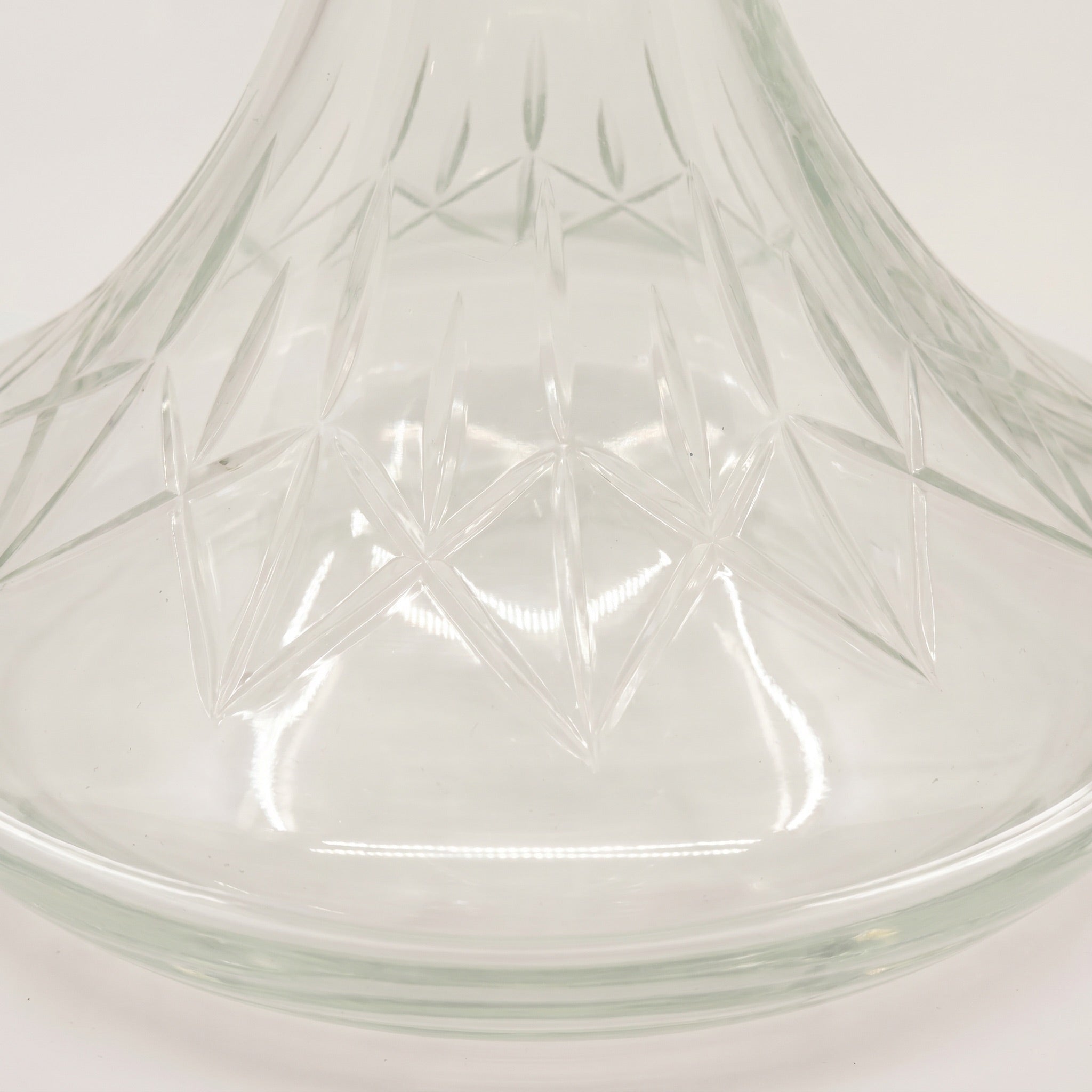 Macro of the Essentials Star-Cut Clear Russian vase belly, showing star-cut geometry and leaf-band collar at the shoulder