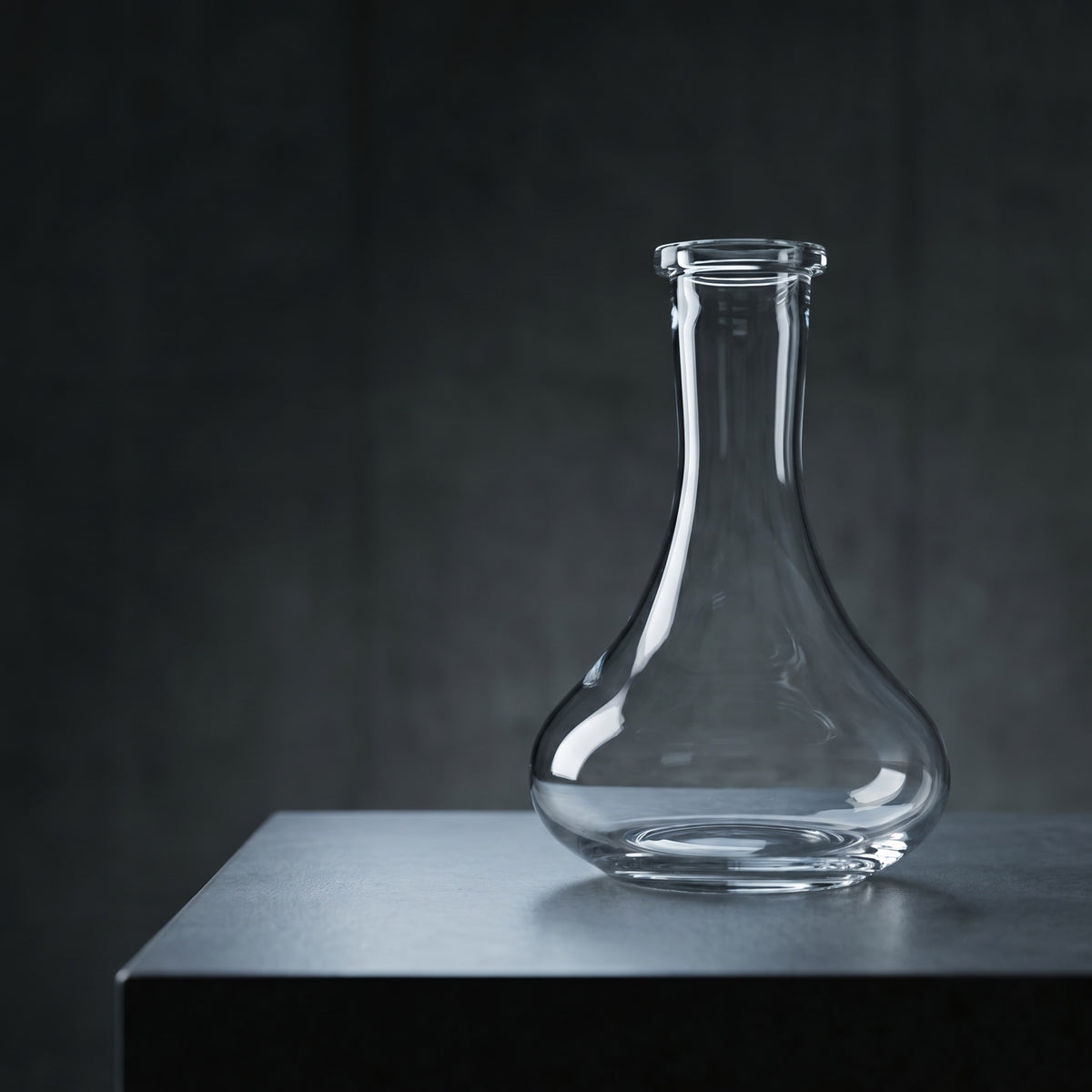 Essentials Tear Drop clear glass shisha vase on dark concrete plinth, modern architectural lighting, Russian-fit replacement base, image 2 of 3