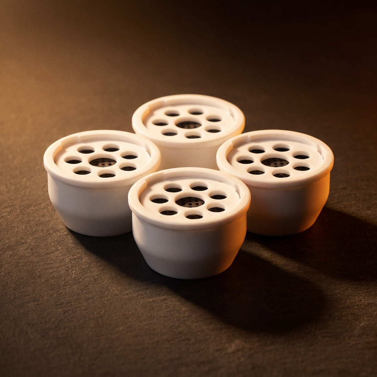 Kaloud Ayara Large filters clustered under warm amber studio light with activated carbon filters visible — The Premium Way, image 2 of 10