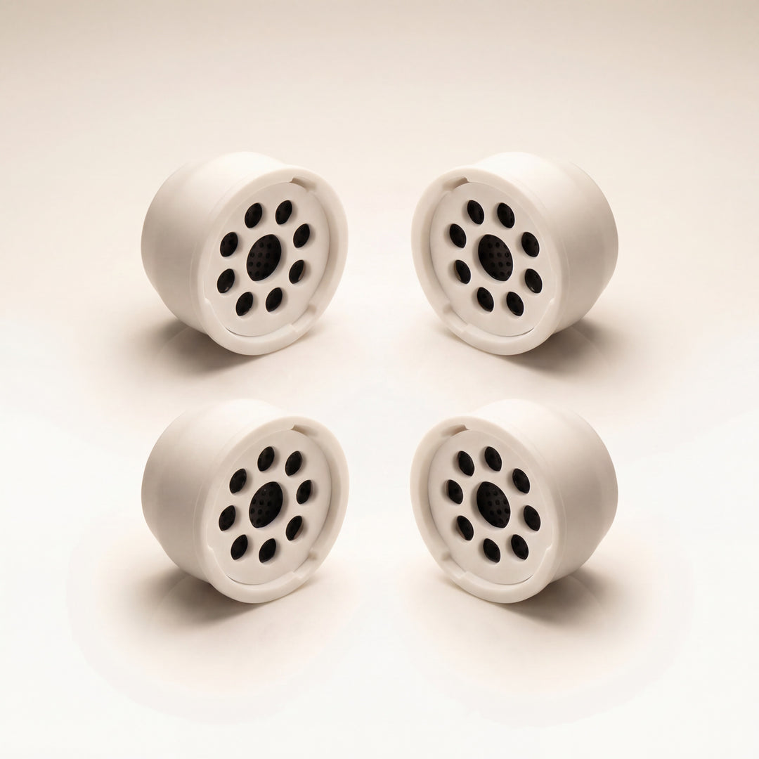 Kaloud Ayara Large replacement filters 4-pack on warm studio white, activated carbon flower-pattern filter faces