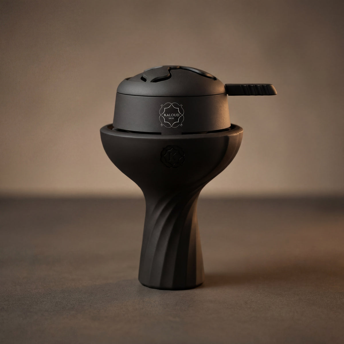Kaloud Lotus I+ Niris Black seated on a matte black phunnel bowl showing the flush seating fit at The Premium Way., image 7 of 15