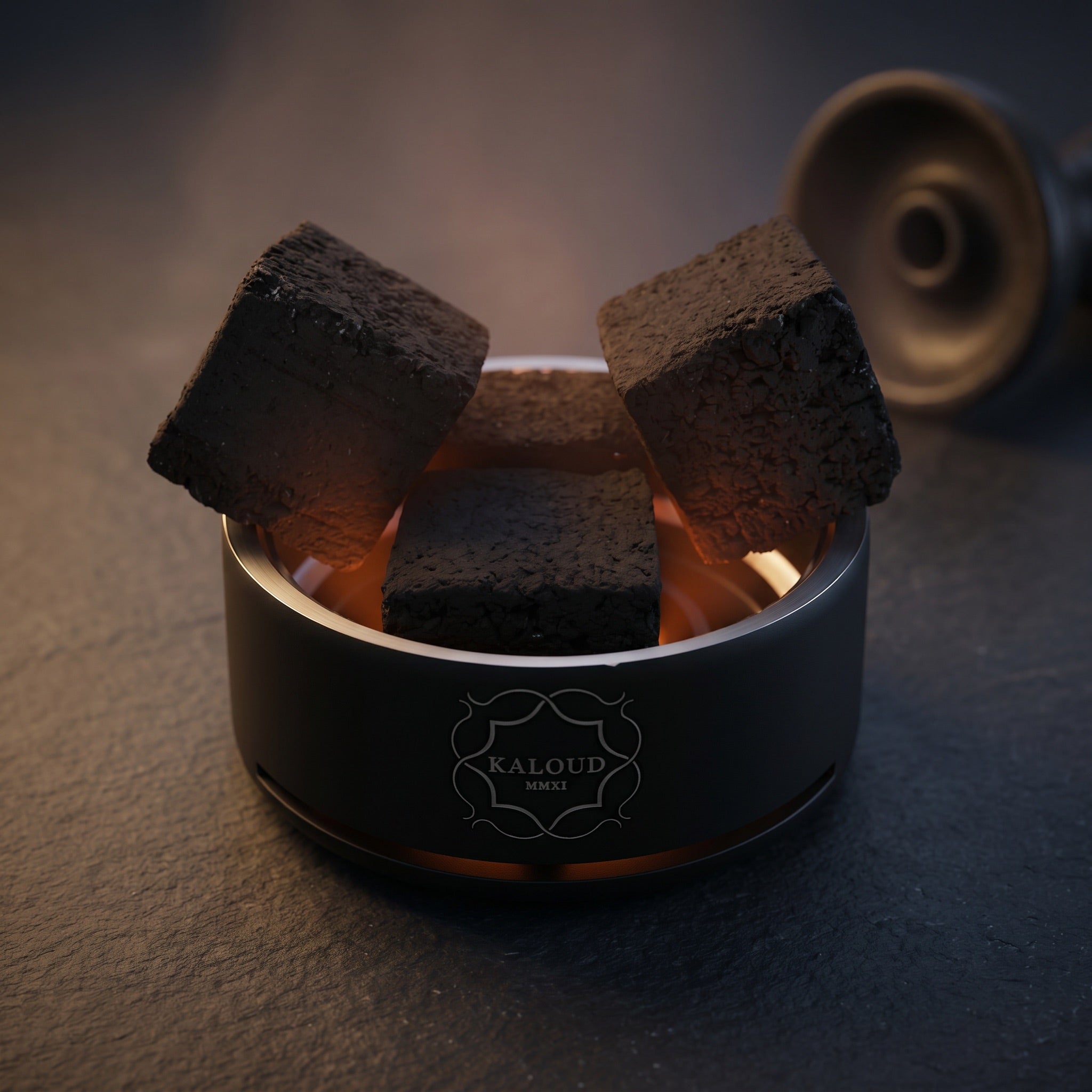Kaloud Lotus I+3 Niris Black HMD loaded with four coconut coals, warm internal glow, slate surface