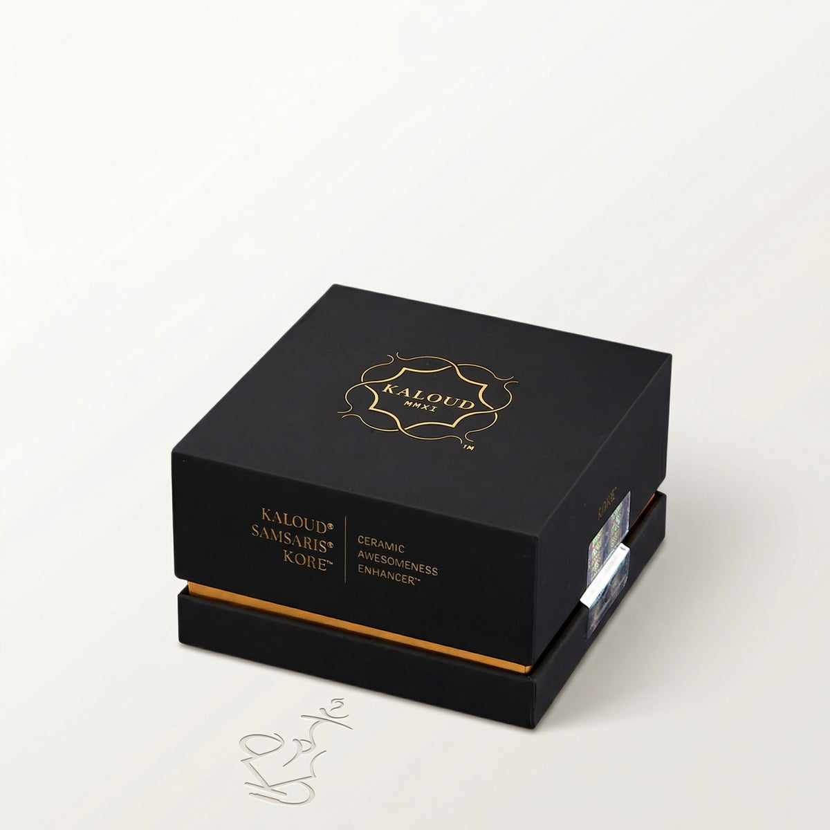 Premium matte black Kaloud Samsaris Kore presentation box with gold foil crest and holographic RFID security sticker, image 7 of 11