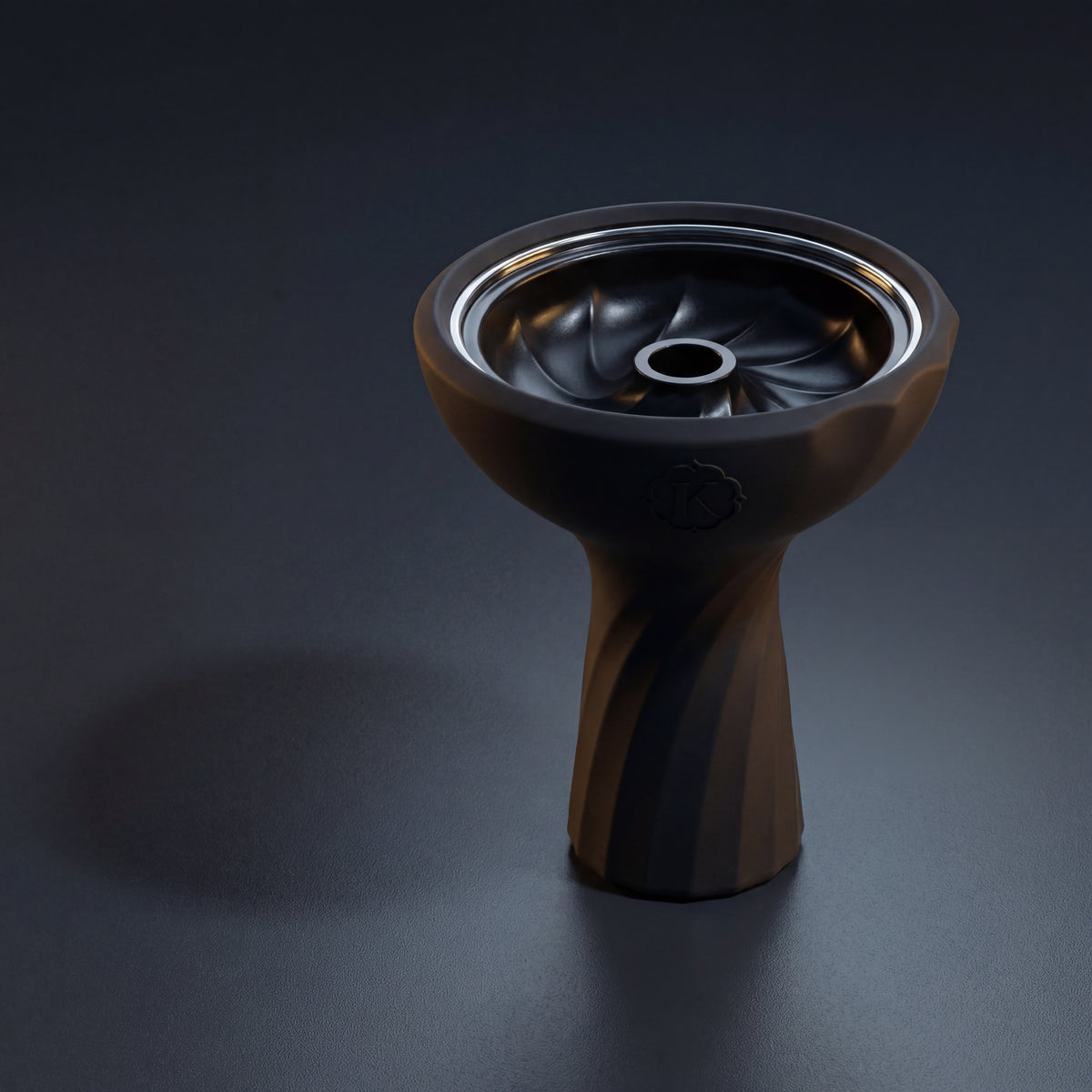 Kaloud Samsaris Lapis II ceramic shisha bowl on polished slate in dim modern interior with warm directional light catching the chrome ring, image 2 of 13