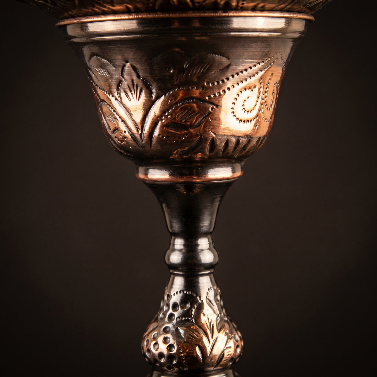 Close-up of the Khalil Mamoon 1566 Oxide Mismatch stem showing hand-struck grape-and-leaf repoussé and oxide tonal variation, image 4 of 21