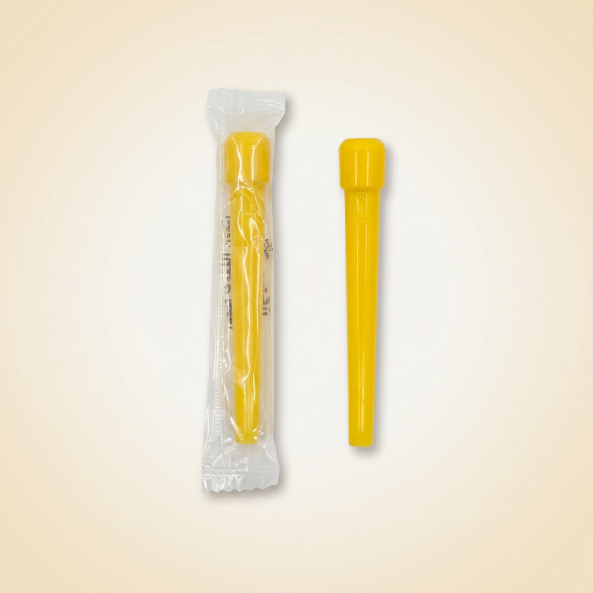 Single Khalil Mamoon disposable shisha tip shown sealed in its individual wrapper beside an unwrapped yellow tip, image 4 of 10