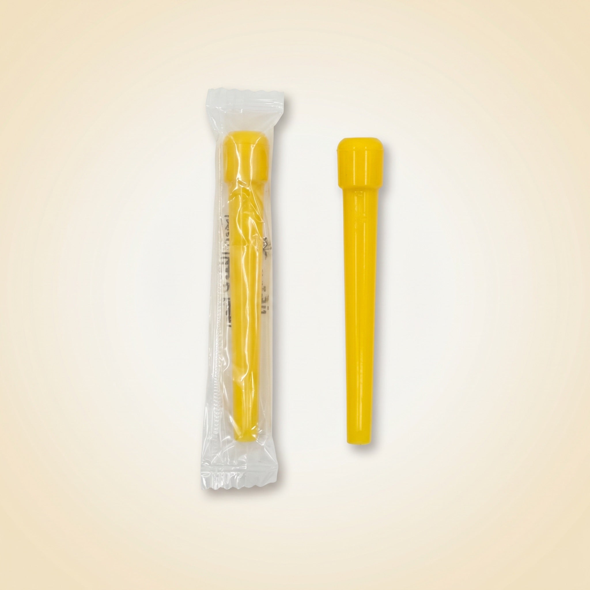 Single Khalil Mamoon disposable shisha tip shown sealed in its individual wrapper beside an unwrapped yellow tip