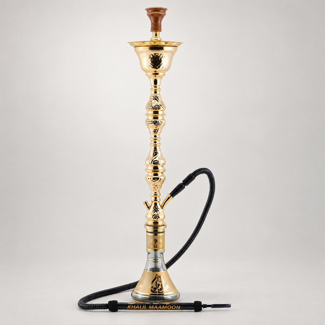 Khalil Mamoon Ice Koumetra Gold Two Level Shisha with clay bowl and Khalil Mamoon leather hose on a plain light studio background