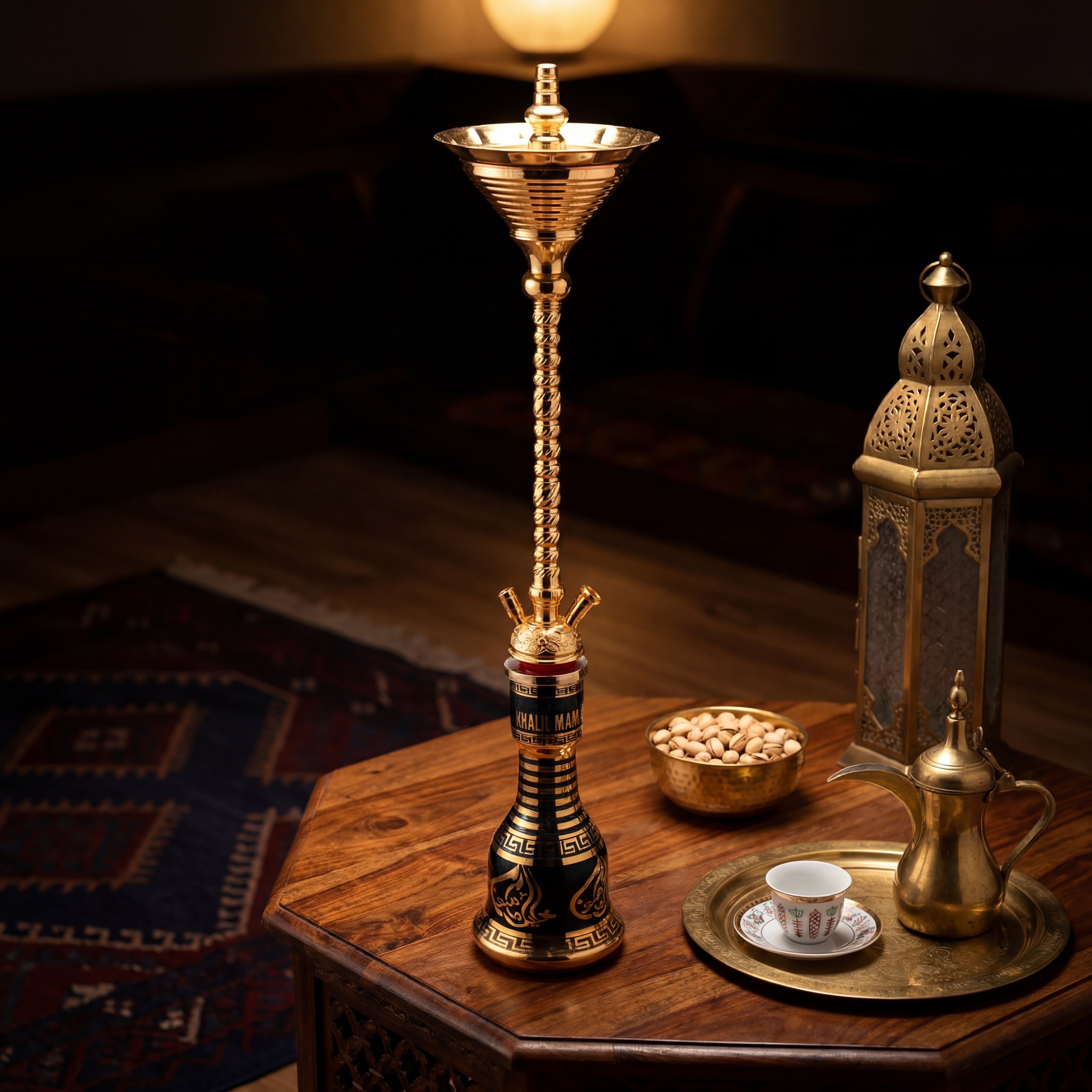 Khalil Mamoon Skinny Gold hookah on carved wood table with brass dallah finjan and lantern in warm evening majlis