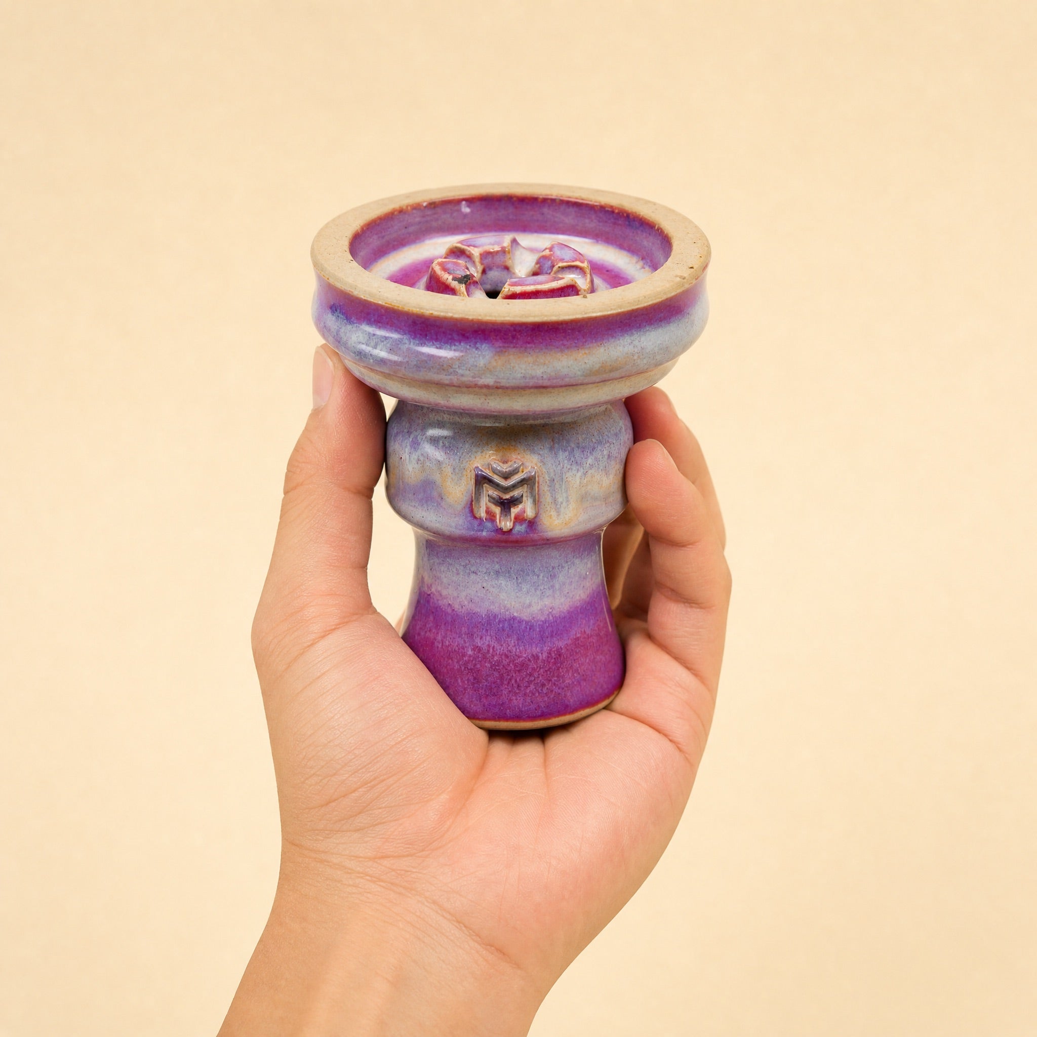 MIT Luxury Ashera Coral bowl held in hand, showing scale and rose-mauve drip-glaze finish