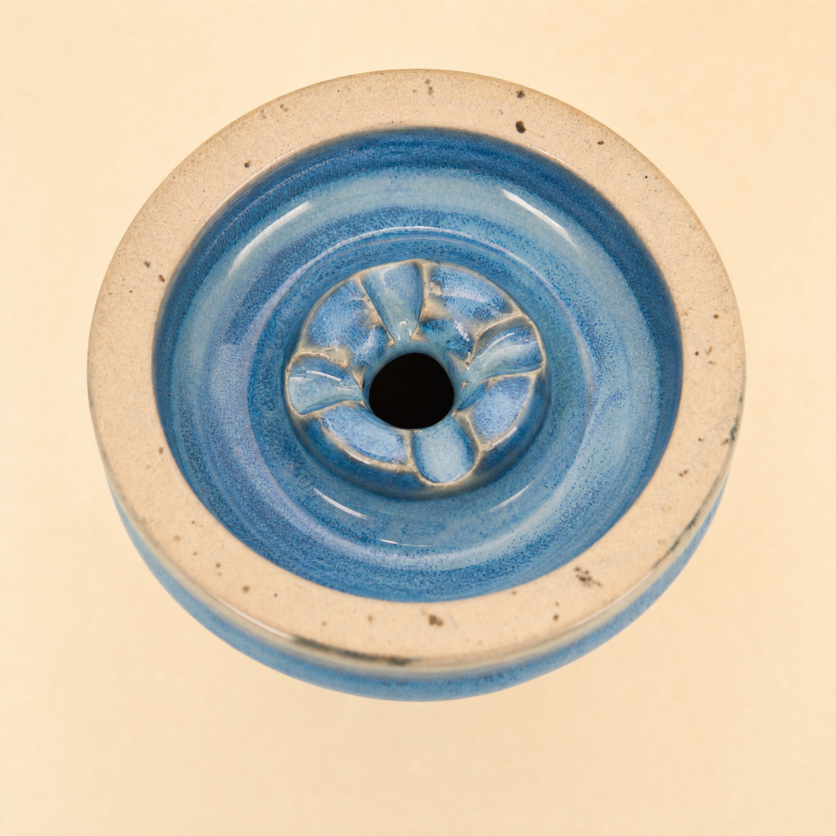 MIT Luxury Ashera Tide bowl macro top-down detail of azure-blue mottled glaze around the phunnel spire, image 6 of 6