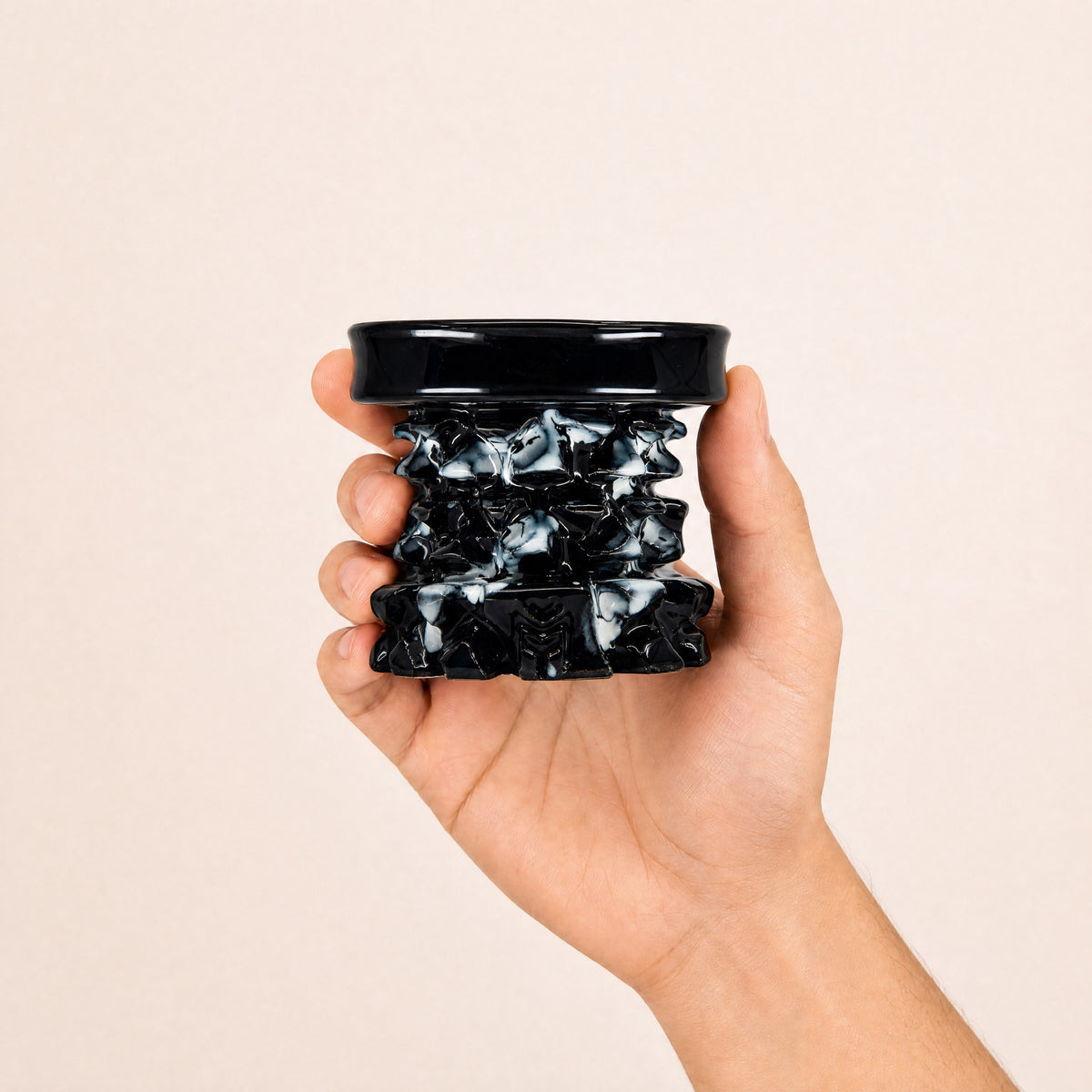 MIT Luxury Mitovation V2 Onyx bowl held in hand, showing 80mm scale and marbled black-and-cream relief, image 5 of 6