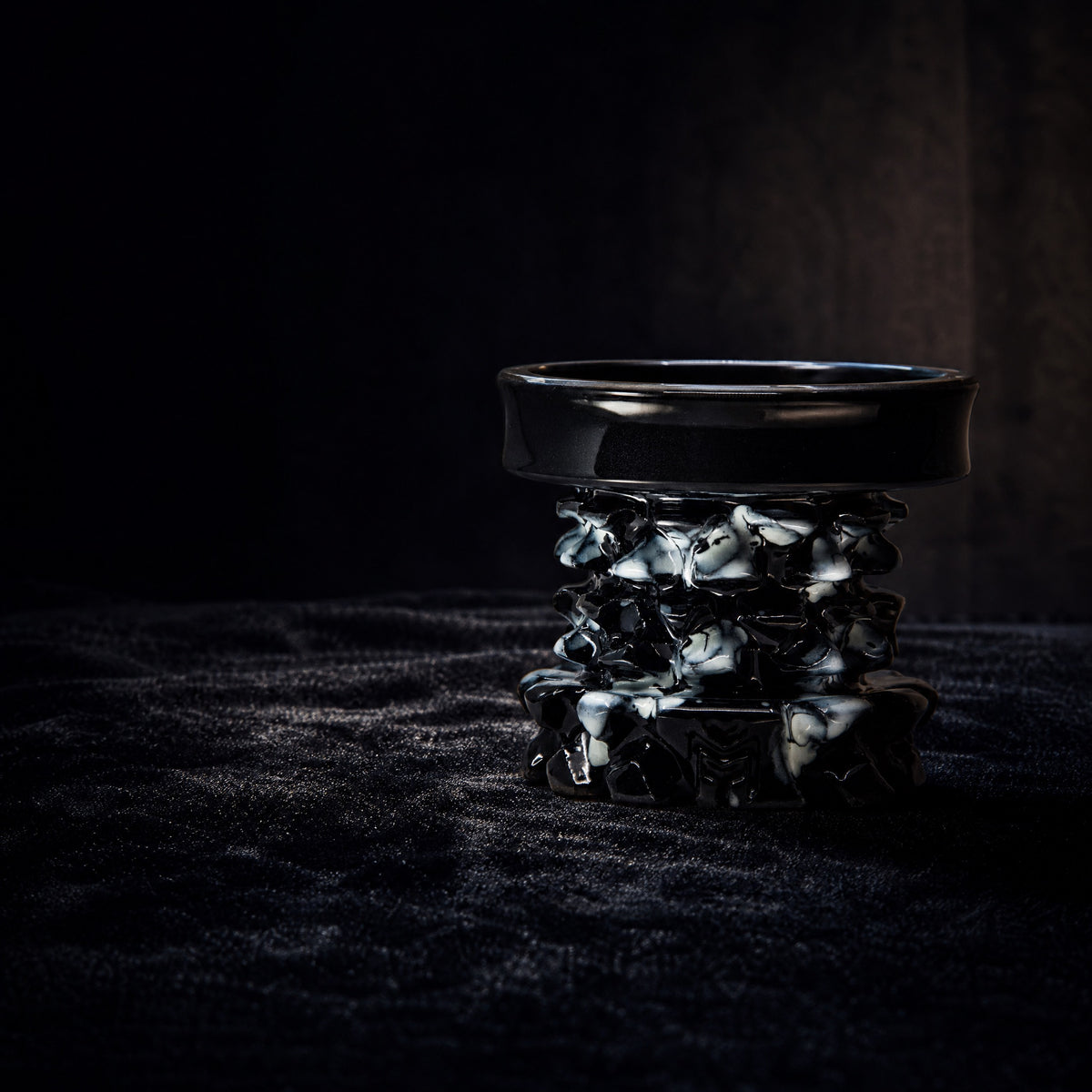 MIT Luxury Mitovation V2 Onyx bowl on black velvet vitrine, gallery specimen lit by single directional spotlight, image 2 of 6