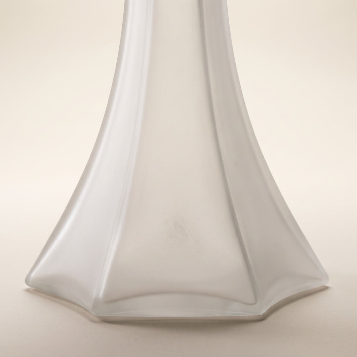 OVO x Neolux Frosty White hookah base close-up showing six-facet splayed skirt geometry and frosted glass finish, The Premium Way, image 4 of 5