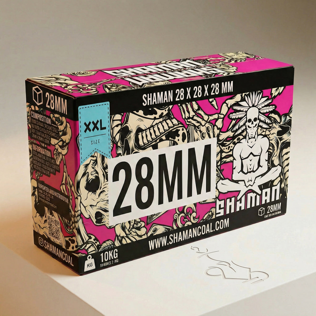 Shaman 28mm coconut shisha charcoal 10kg master case three-quarter view showing wide landscape box with bold 28MM branding and tattoo-style artwork on warm white studio background, image 5 of 10