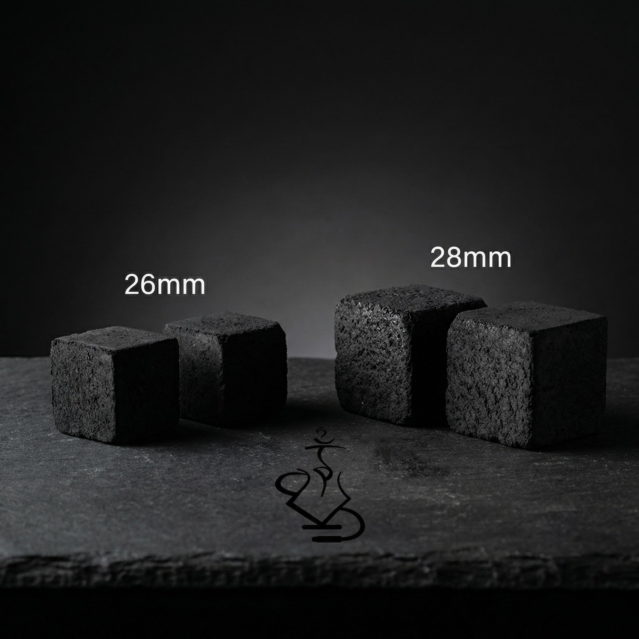 Shaman coconut charcoal size comparison showing smaller 26mm cubes next to larger 28mm XXL cubes on dark slate surface