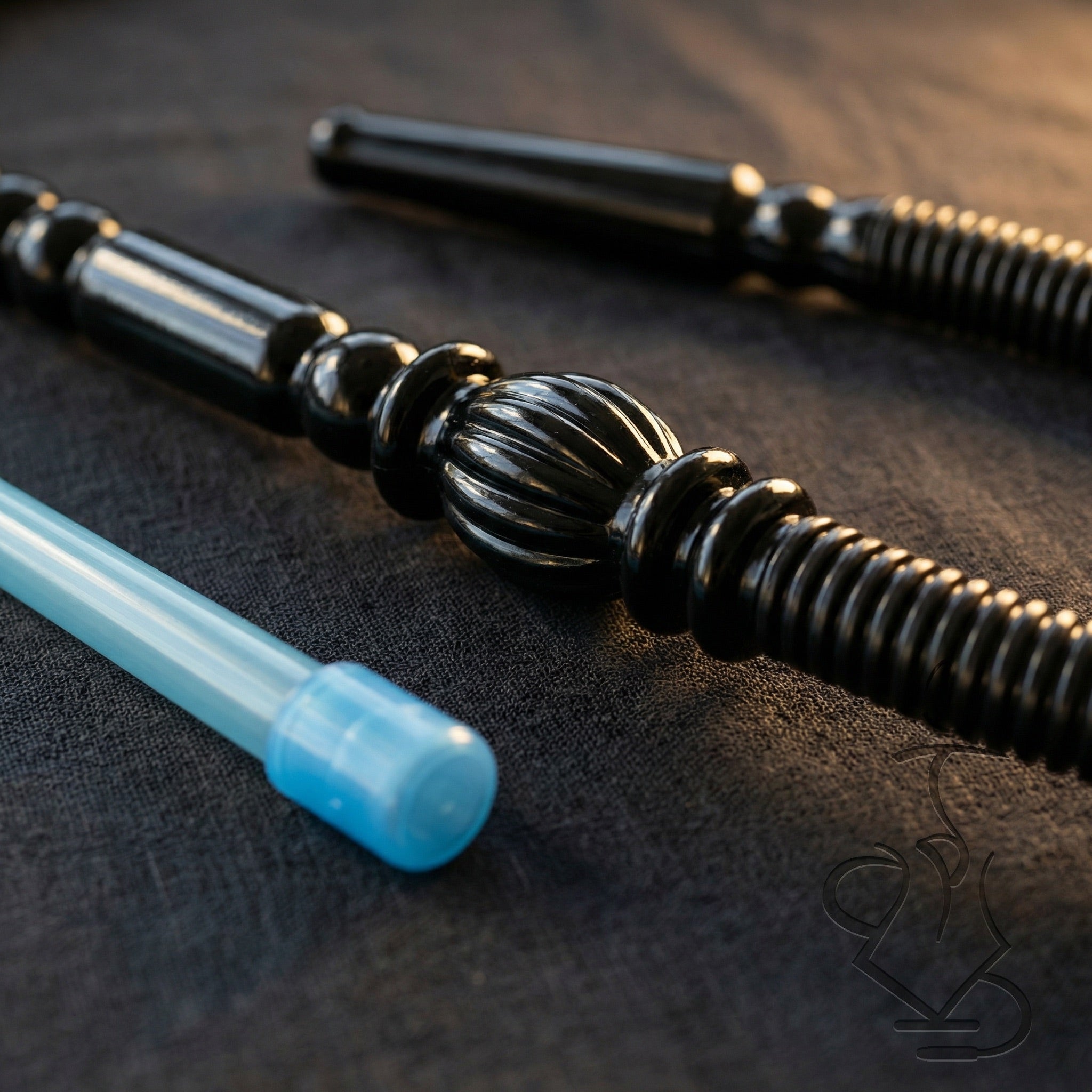 Close-up detail of ShishaDoc disposable hookah hose ornamental handle showing sculpted bulb and beaded grip with mouth tip