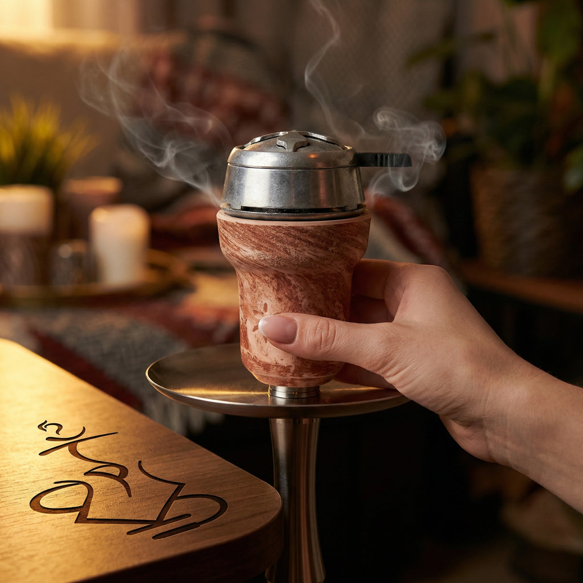 Solaris Titan clay hookah bowl in use on a hookah with heat management device, warm session setting with subtle smoke, image 2 of 5