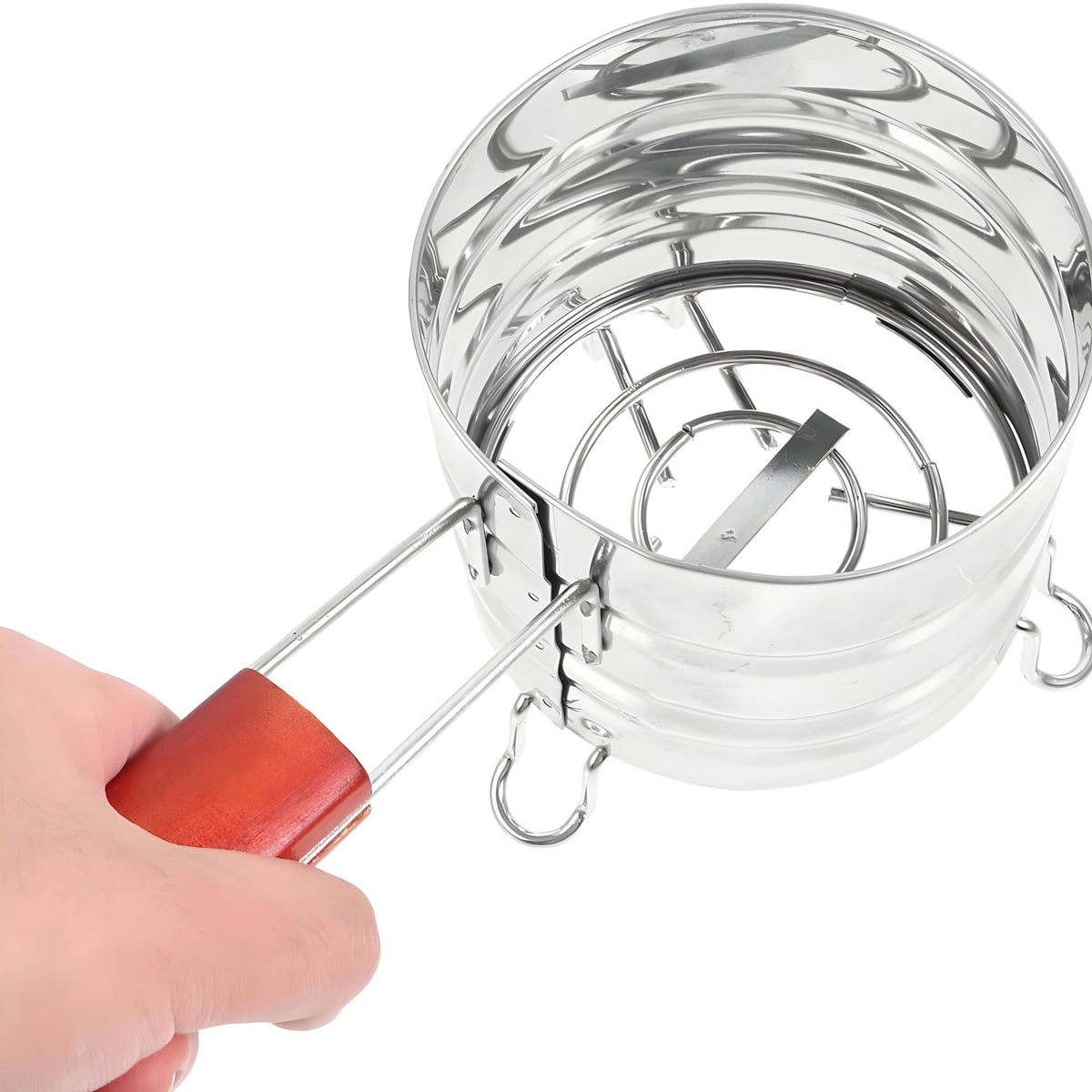 Stainless steel charcoal holder with wooden handle, held by a hand, image 9 of 9