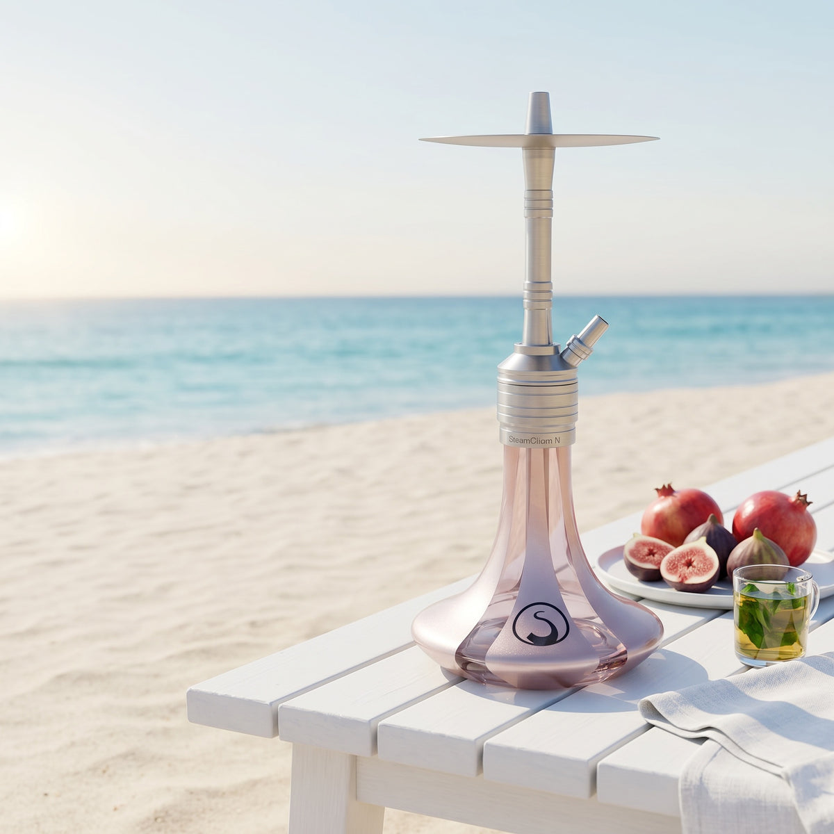 Steamulation Mini Gen II Rose Metallic hookah on white beach bench by turquoise ocean, figs and mint tea, image 2 of 10