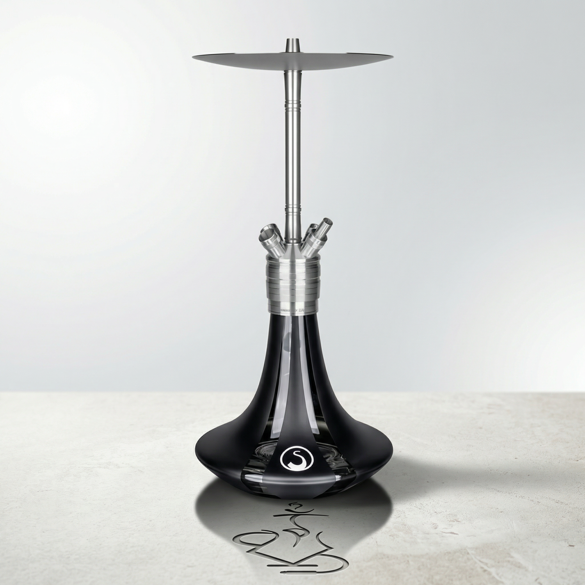 Steamulation Ultimate Gen II hookah in Black Matt finish with deep black satin base on a light concrete surface