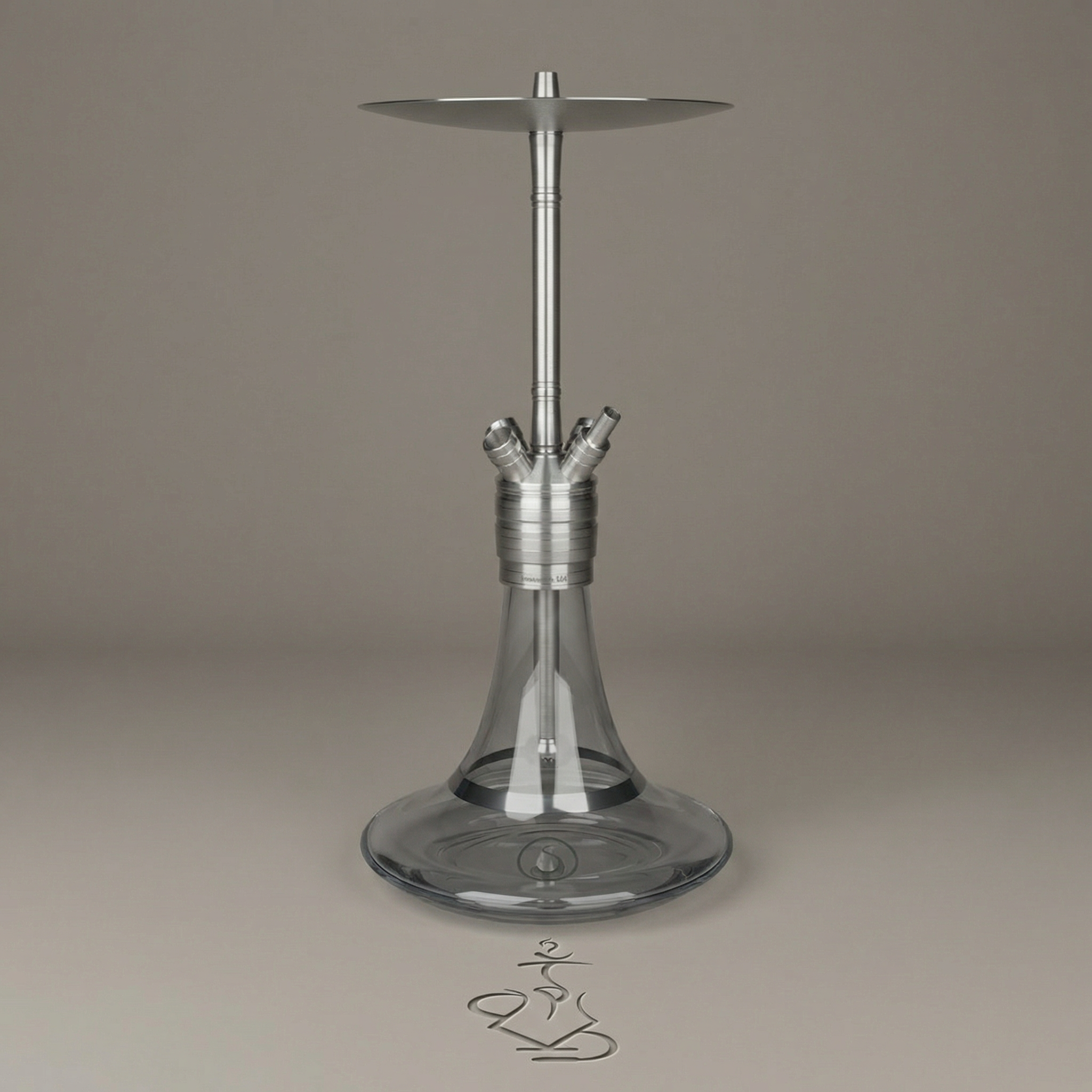 Steamulation Ultimate Gen II hookah in Clear finish with smooth transparent glass base on a warm grey surface