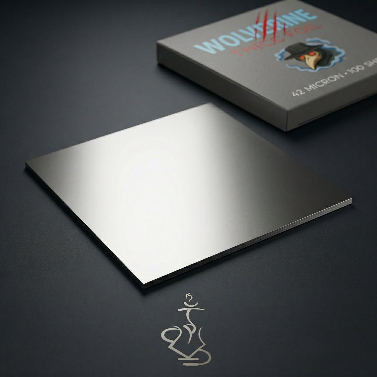 Wolverine heavy-duty plain aluminium hookah foil sheets on dark surface with Thicc Foil dispenser box showing silver metallic sheen, image 3 of 9