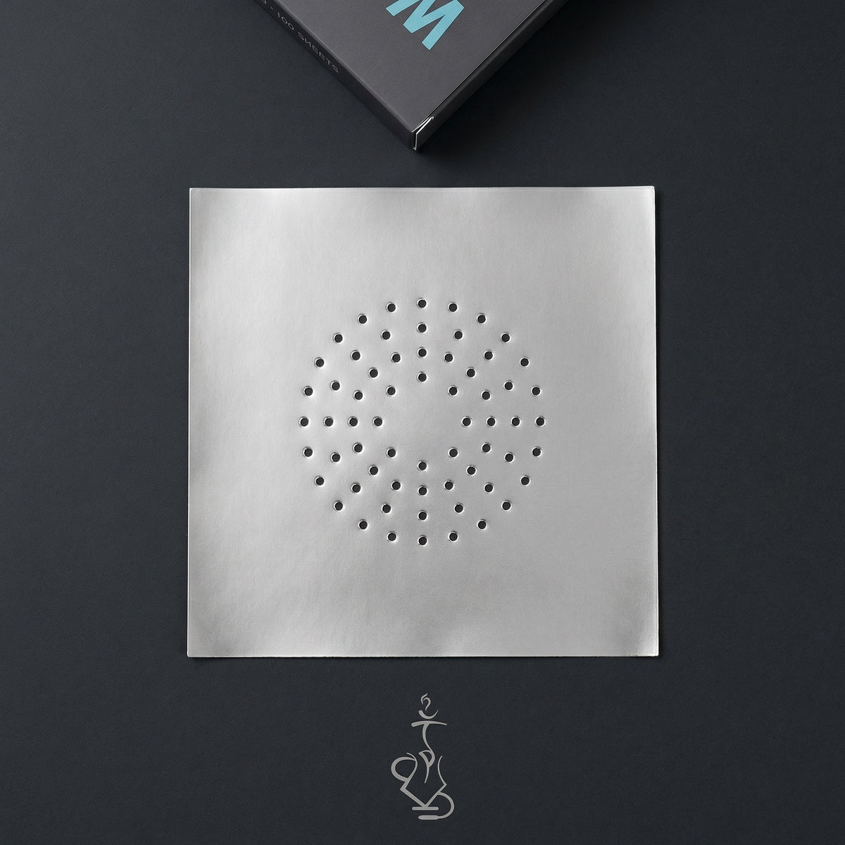 Wolverine 42-micron pre-poked hookah foil sheet showing scattered hole pattern on dark surface with Thicc Foil dispenser box, image 4 of 9